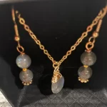 Handcrafted with 18 karat gold field wire, labradorite, gemstone earrings, and necklace